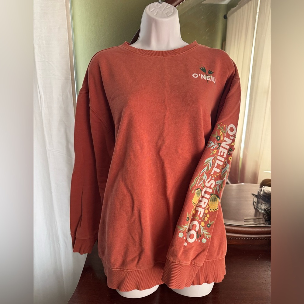 Cute springy dark peach sweatshirt. Like new, O’Neil size Large